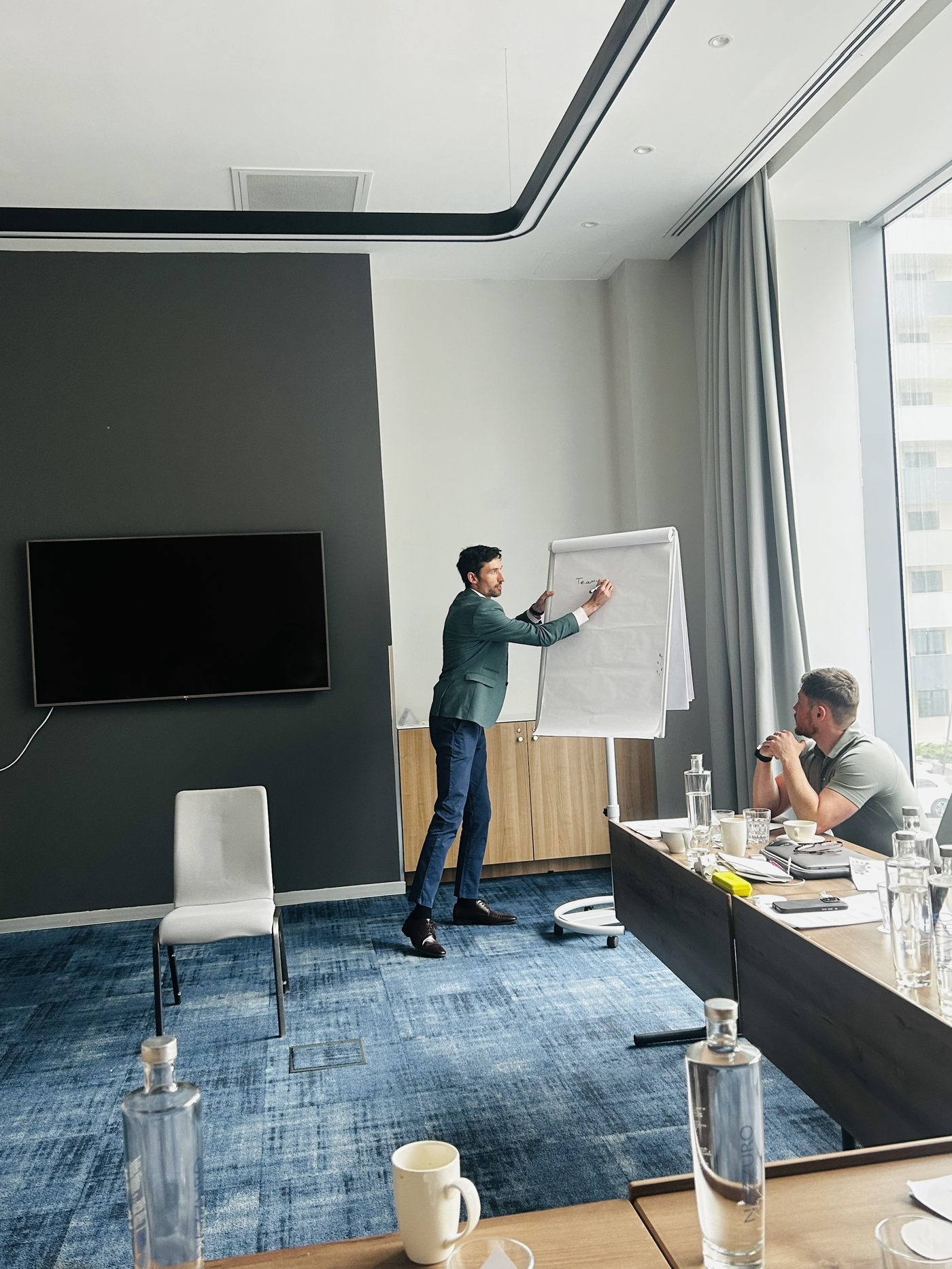 Ian Lynch facilitating a workshop at a flip chart
